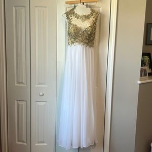 White chiffon w/gold jewel detail. Worn once formal gown. Has been dry cleaned.